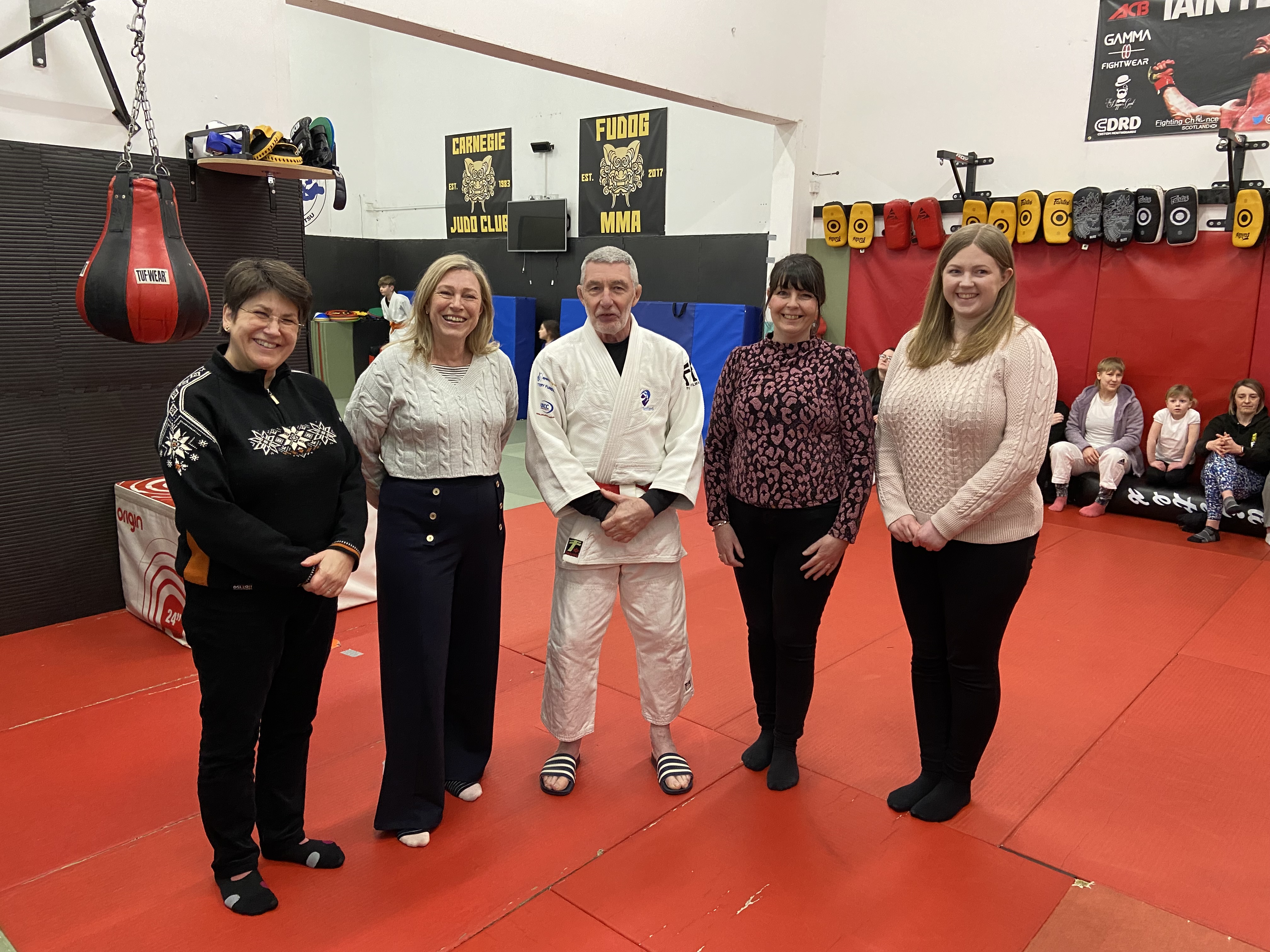 A photograph of Committee Members visiting the Fighting Chance Judo Project